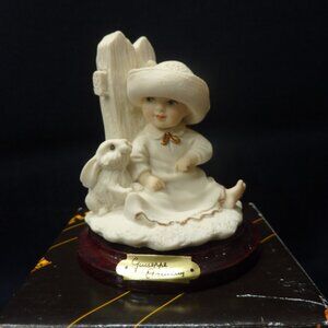 Guiseppe Armami child with rabbit figurine